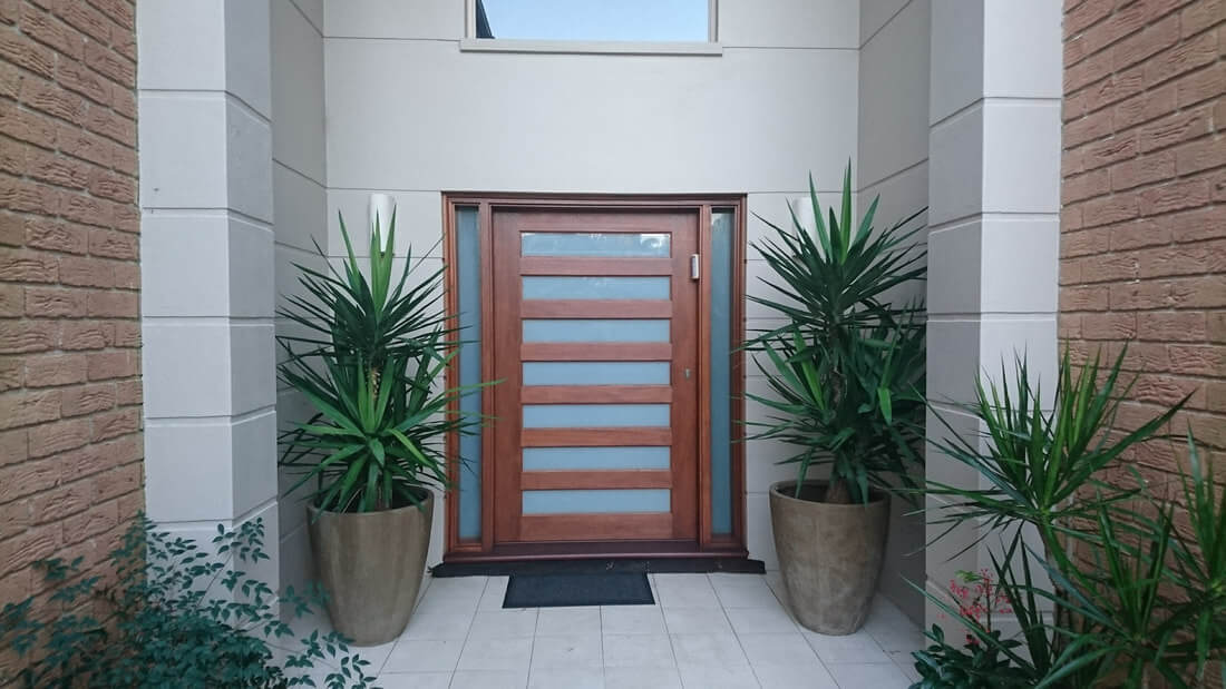 Wooden door with glass design