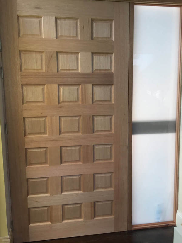 Internal side of 21 panel 2400 x 1200 solid meranti joinery door.